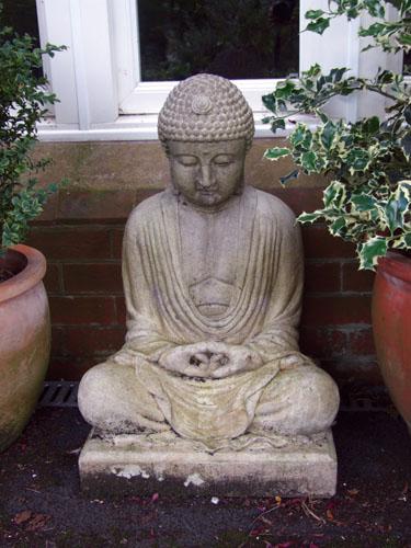 Photo of Meditating Buddha Stone Statue