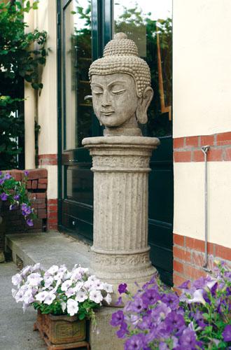 Photo of Stone Buddha Head on Large Doric Column