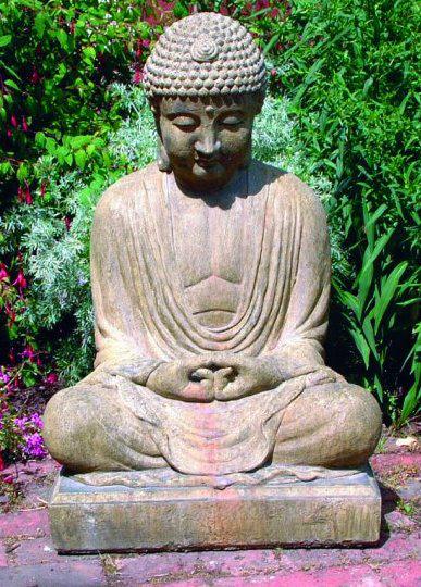 Photo of Meditating Buddha Stone Statue