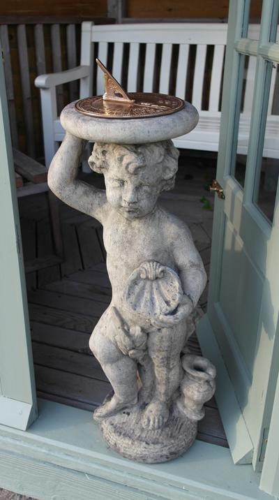 Photo of Stone Cherub with Aged Brass Sundial Plate