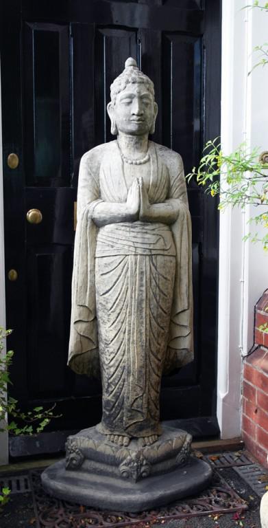 Photo of Standing Buddha Stone Statue