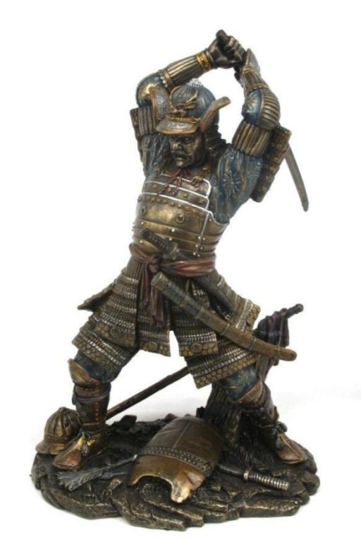 Photo of Samurai Attacking Bronze Figurine Sword Above Head