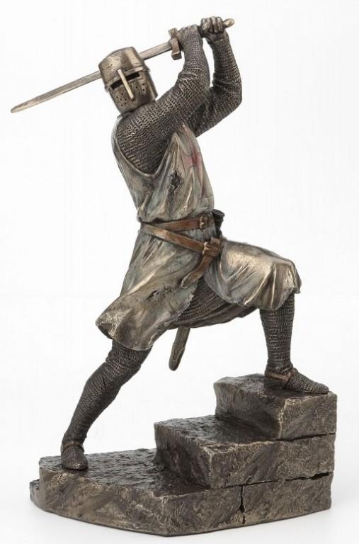 Photo of Knight with Sword Attacking Bronze Figurine